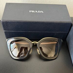 Prada Women's Sunglasses in Black with Gold Trim